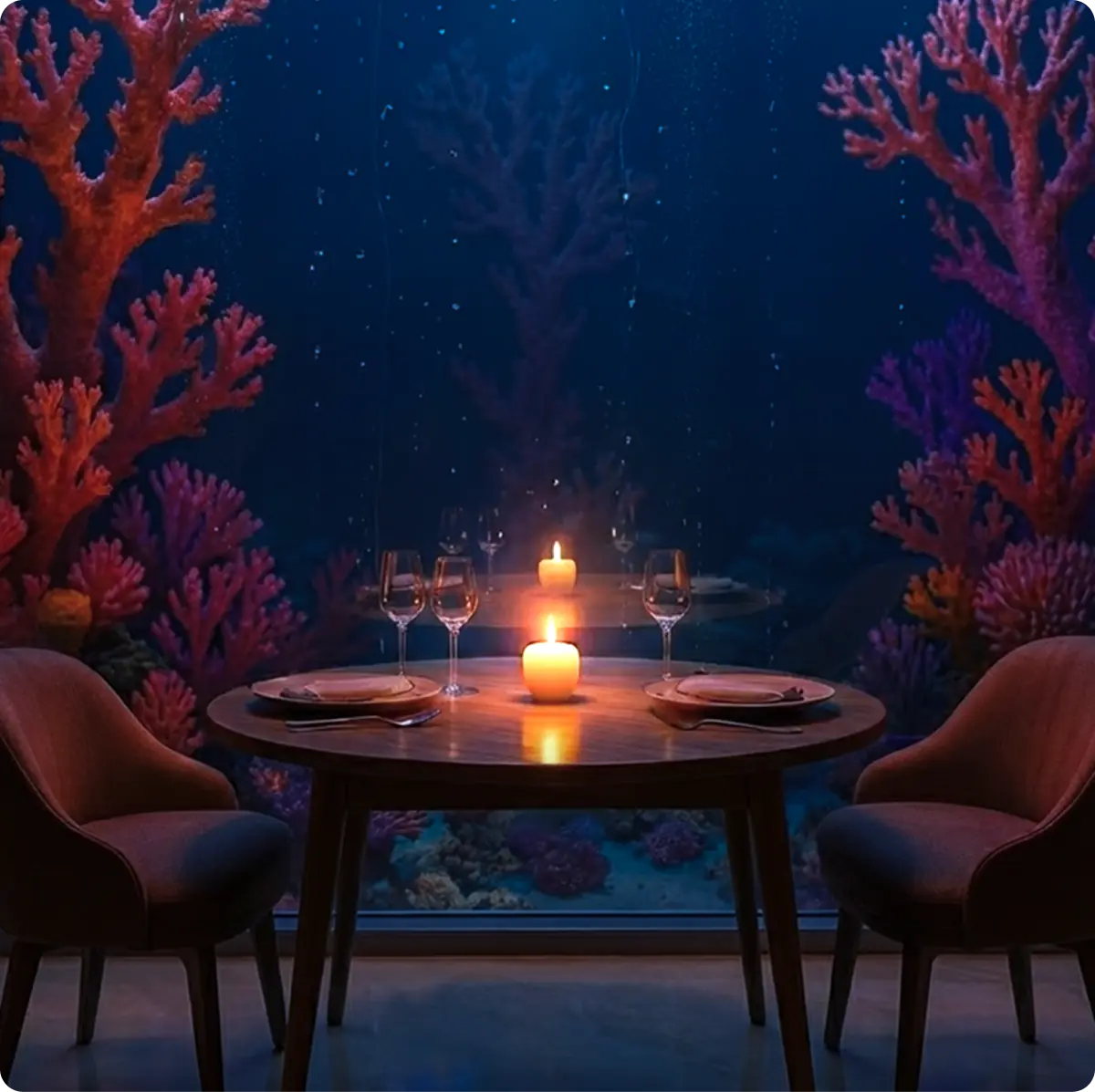 Tavolo romantico vista oceano del ristorante Riff: cena intima a lume di candela con affaccio diretto sulla barriera corallina.